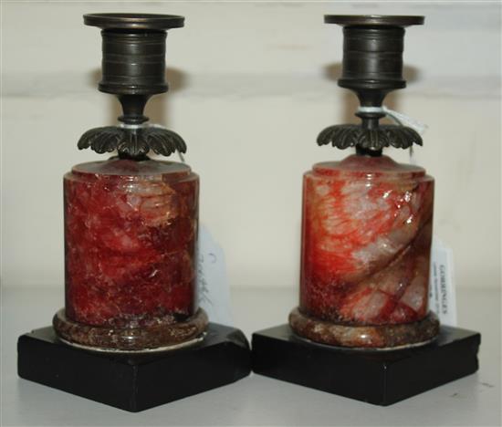 A pair of Regency bronze and red fluorospar / Blue John mounted candlesticks, 6.25in.